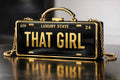 THAT GIRL luxury license plate style clutch with black and gold finish